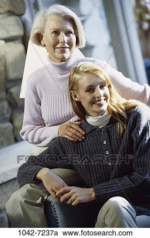 Stock Image - women, people, smiling, senior, mother, tranquility, Middle-aged. Fotosearch