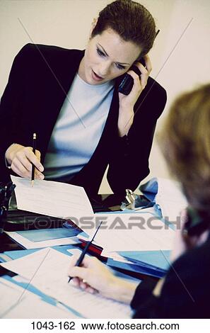 women, telephone, consultation, paperwork, Hispanic, phone, business View Large Photo Image Stock Image - women, telephone, consultation, paperwork, Hispanic, phone, business. Fotosearch