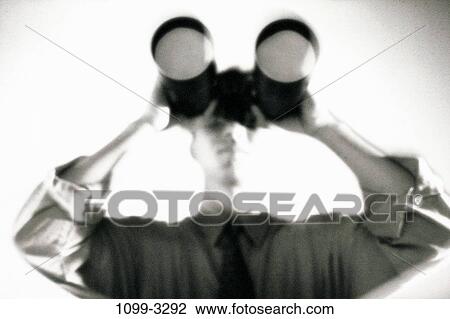 Stock Image - binoculars, business, curious, future, looking, serious. Fotosearch