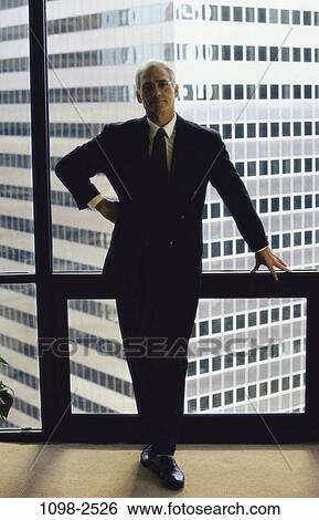 business, Middle-aged, businessman, indoors, executive View Large Photo Image Stock Photograph - business, Middle-aged, businessman, indoors, executive. Fotosearch