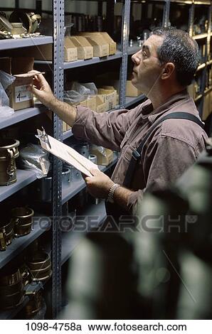 Stock Image - count, warehouse, Caucasian, counting, inventory, accuracy. Fotosearch