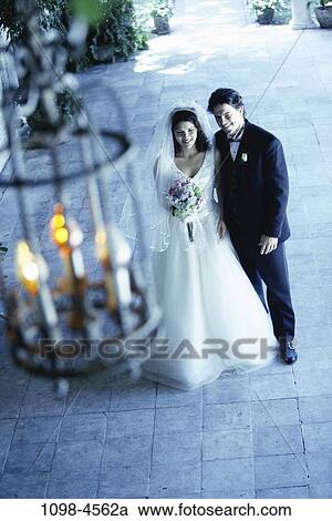 couple, Hispanic, flowers, outdoors, commitment, beginnings, husband View Large Photo Image Stock Image - couple, Hispanic, flowers, outdoors, commitment, beginnings, husband. Fotosearch