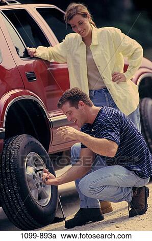 couple, transportation, joyous, teamwork, tire, unity, humor View Large Photo Image Stock Image - couple, transportation, joyous, teamwork, tire, unity, humor. Fotosearch