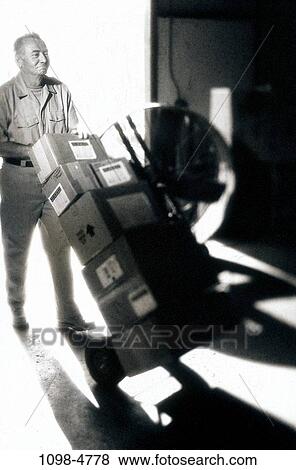 Stock Photo - delivery, warehouse, boxes, deliver, Caucasian, packages. Fotosearch