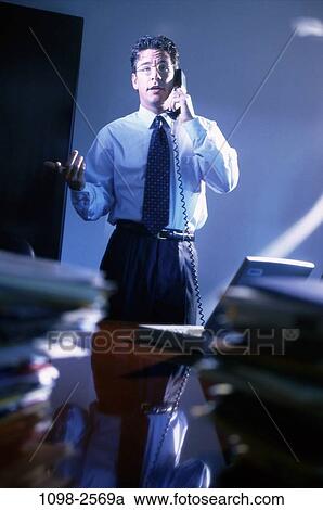 desk, telephone, talking, eyeglasses, conversation, laptop View Large Photo Image Stock Image - desk, telephone, talking, eyeglasses, conversation, laptop. Fotosearch