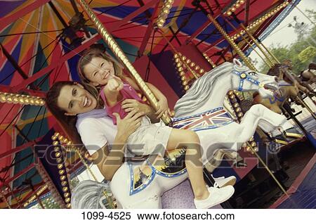 excitement, mother, laughing, riding, amusement, entertainment View Large Photo Image Stock Photography - excitement, mother, laughing, riding, amusement, entertainment. Fotosearch
