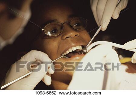 eyeglasses, teeth, patient, dentist, doctor, equipment, tools View Large Photo Image Stock Image - eyeglasses, teeth, patient, dentist, doctor, equipment, tools. Fotosearch