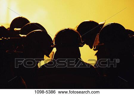 Stock Photograph - fire, industry, silhouette, monochromatic, occupation, headshot. Fotosearch