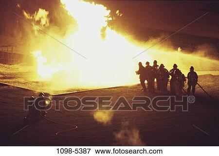 Stock Photo - fire, industry, water, spraying, teamwork, spray, hose. Fotosearch