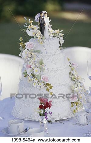 formal, cake, decorated, flowers, stacked, outdoors, tradition View Large Photo Image Stock Image - formal, cake, decorated, flowers, stacked, outdoors, tradition. Fotosearch