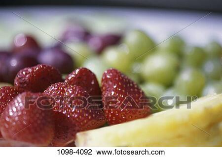 Stock Image - grapes, fruit, pineapple, food, still life, strawberries. Fotosearch