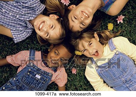 grass, multiethnic, overhead, people, happy, laughing View Large Photo Image Stock Image - grass, multiethnic, overhead, people, happy, laughing. Fotosearch