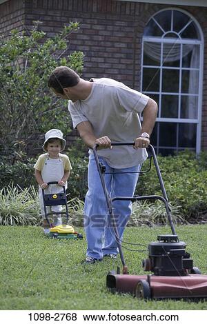 Stock Photo - grass, people, lawn, playing, outdoors, future, family. Fotosearch