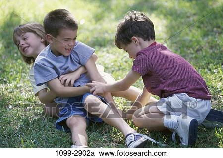 grass, people, playing, playful, outdoors, energetic View Large Photo Image Stock Image - grass, people, playing, playful, outdoors, energetic. Fotosearch
