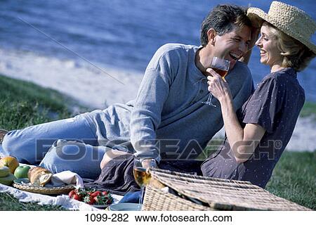 grass, people, relaxation, water, couple, ocean, wine View Large Photo Image Stock Image - grass, people, relaxation, water, couple, ocean, wine. Fotosearch