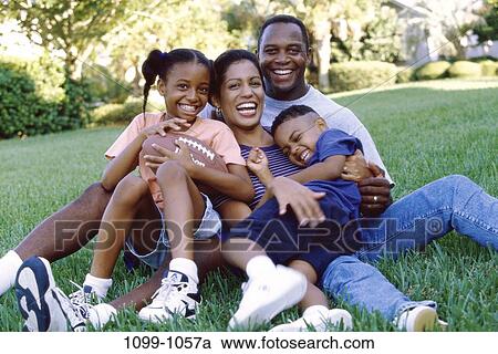 grass, people, smiling, ground, sitting, football, outdoors View Large Photo Image Stock Image - grass, people, smiling, ground, sitting, football, outdoors. Fotosearch