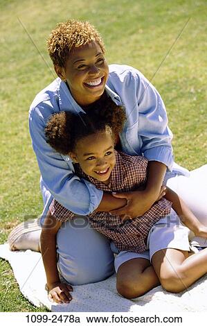 grass, people, smiling, sitting, mother, happy, holding View Large Photo Image Stock Image - grass, people, smiling, sitting, mother, happy, holding. Fotosearch