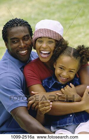 grass, people, smiling, sitting, laughing, outdoors, hugging View Large Photo Image Stock Image - grass, people, smiling, sitting, laughing, outdoors, hugging. Fotosearch
