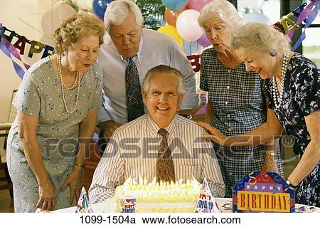 Stock Image - group, people, party, celebration, senior, balloons, cake. Fotosearch