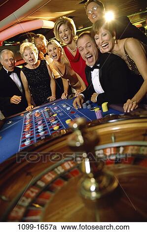Stock Image - group, people, wheel, risk, Middle-aged, joyous, nightlife. Fotosearch
