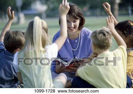 group, teacher, school, reading, book, outdoors, questioning View Large Photo Image Stock Photo - group, teacher, school, reading, book, outdoors, questioning. Fotosearch
