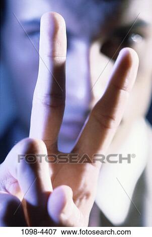 Stock Photo - hand, gesturing, Middle-aged, fingers, serious, gesture. Fotosearch