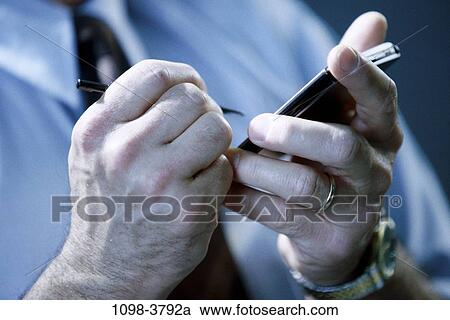 hands, computer, holding, business, Middle-aged, using View Large Photo Image Stock Image - hands, computer, holding, business, Middle-aged, using. Fotosearch