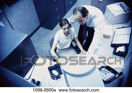 instructing, overhead, desk, computer, business, Middle-aged, explaining View Large Photo Image Stock Image - instructing, overhead, desk, computer, business, Middle-aged, explaining. Fotosearch