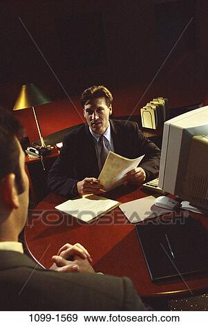 meeting, men, desk, consultation, talking, papers, computer View Large Photo Image Stock Photo - meeting, men, desk, consultation, talking, papers, computer. Fotosearch