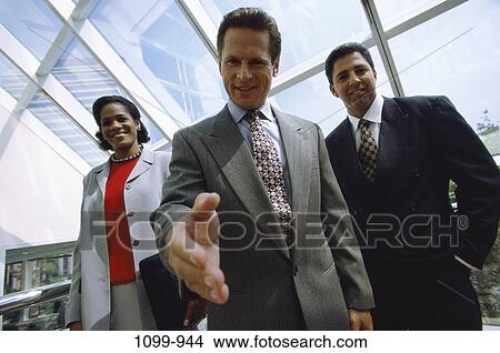 Picture - meeting, multiethnic, hand, business, shaking, greeting. Fotosearch