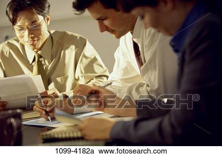 meeting, multiethnic, paperwork, busy, business, Middle-aged, indoors View Large Photo Image Stock Image - meeting, multiethnic, paperwork, busy, business, Middle-aged, indoors. Fotosearch