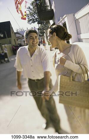 meeting, people, walking, couple, Hispanic, sweater, sunglasses View Large Photo Image Stock Image - meeting, people, walking, couple, Hispanic, sweater, sunglasses. Fotosearch