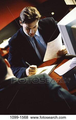 men, desk, consultation, papers, computer, business, Middle-aged View Large Photo Image Stock Photo - men, desk, consultation, papers, computer, business, Middle-aged. Fotosearch