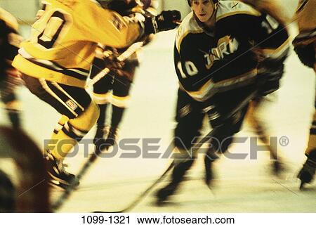 Stock Image - men, motion, sports, speed, competition, team, winter sports. Fotosearch