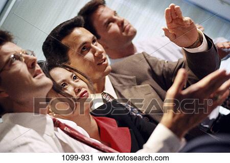 Stock Image - multiethnic, business, confrontation, Middle-aged, teamwork, meetings, serious. Fotosearch