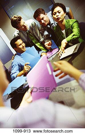 Stock Image - multiethnic, business, Middle-aged, teamwork, executives, meetings, planning. Fotosearch
