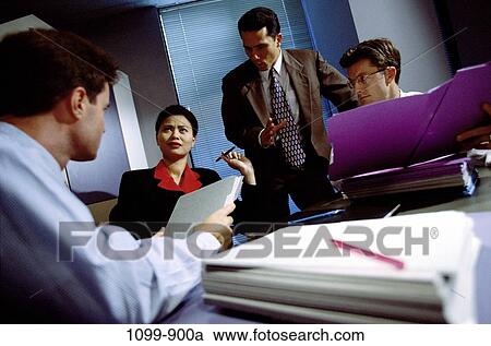 multiethnic, desk, business, challenges, Middle-aged, frustrated, executives View Large Photo Image Stock Image - multiethnic, desk, business, challenges, Middle-aged, frustrated, executives. Fotosearch
