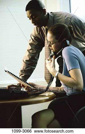 multiethnic, desk, telephone, coworkers, paperwork, papers, phone View Large Photo Image Stock Photograph - multiethnic, desk, telephone, coworkers, paperwork, papers, phone. Fotosearch