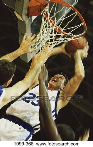 Stock Photo - multiethnic, men, playing, ball, sports, competition, basketball. Fotosearch