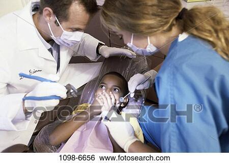 multiethnic, patient, dentist, doctor, anxious, fear, health View Large Photo Image Stock Photograph - multiethnic, patient, dentist, doctor, anxious, fear, health. Fotosearch