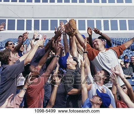 Stock Photo - multiethnic, people, ball, baseball, catching, outdoors. Fotosearch