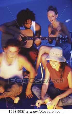 multiethnic, people, beach, guitar, camping, friends, teens View Large Photo Image Stock Image - multiethnic, people, beach, guitar, camping, friends, teens. Fotosearch