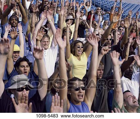 Stock Image - multiethnic, people, excitement, outdoors, cheering, crowd, stadium. Fotosearch