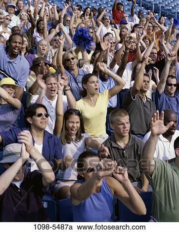 Stock Image - multiethnic, people, excitement, outdoors, cheering, crowd, stadium. Fotosearch