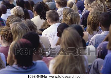 Stock Image - multiethnic, people, outdoors, crowd, backside, stadium, spectators. Fotosearch