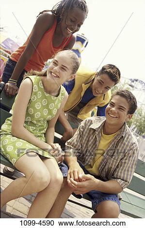 multiethnic, people, smiling, bench, sitting, laughing, leaning View Large Photo Image Stock Image - multiethnic, people, smiling, bench, sitting, laughing, leaning. Fotosearch