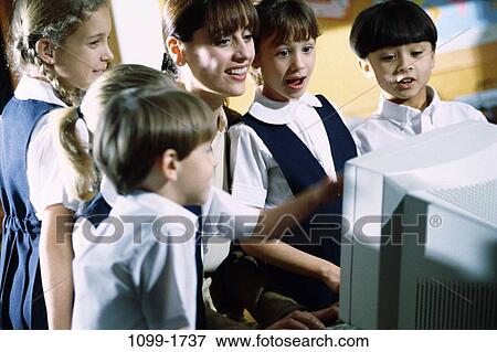 multiethnic, people, teacher, excitement, school, computer, awe View Large Photo Image Stock Photo - multiethnic, people, teacher, excitement, school, computer, awe. Fotosearch