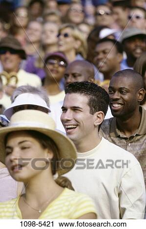 Stock Image - multiethnic, people, watch, outdoors, watching, crowd, enjoying. Fotosearch