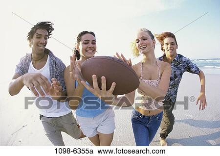 multiethnic, people, water, playing, beach, football View Large Photo Image Stock Image - multiethnic, people, water, playing, beach, football. Fotosearch