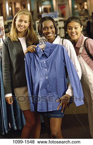 Stock Photo - multiethnic, women, people, shirt, shopping, diversity, mall. Fotosearch